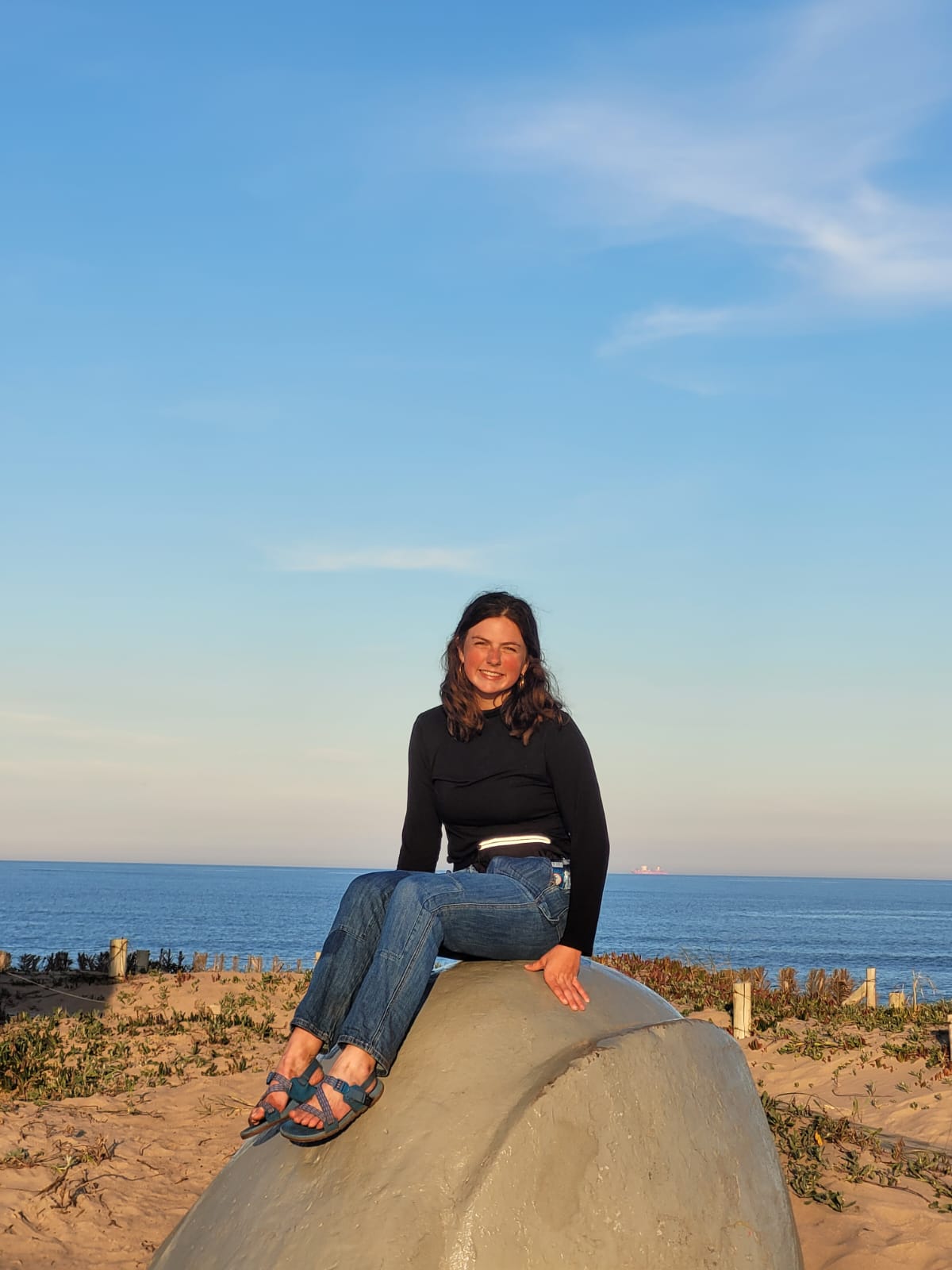 Lindsey Pegram sits on a boulder in Uruguay